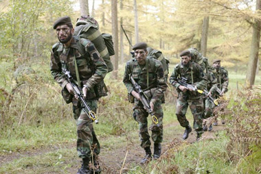 Pakistani soldiers patrol in Wales, UK, demonstrating capabilities by completing challenges including observation and reconnaissance of enemy forces, cold-river crossings in full kit without access to boats, first-aid and defensive shooting under attack. Oct. 2010.